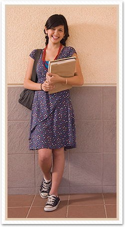 female student leaning on wall